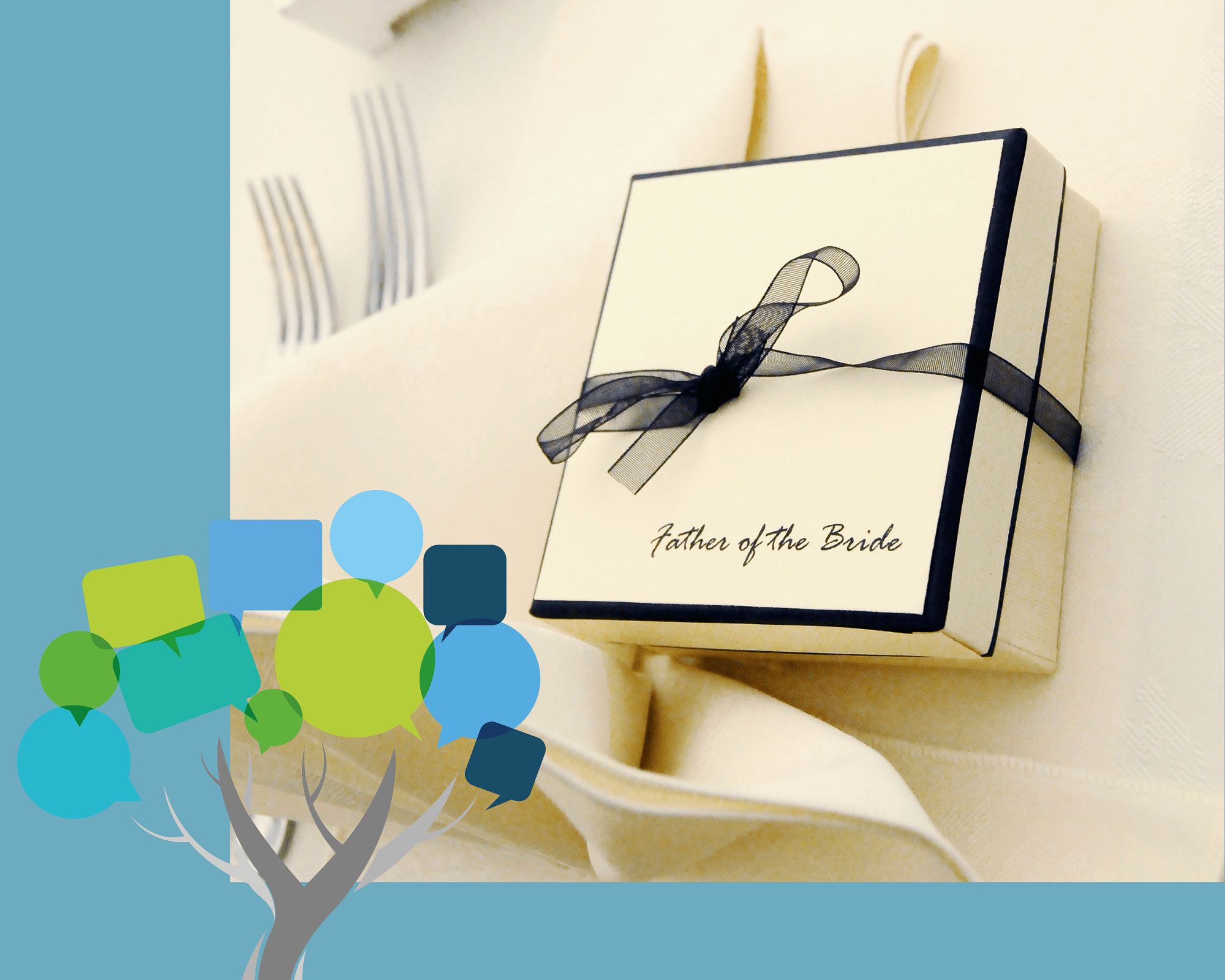A cream gift box tide with a black ribbon and bow. Written on it is Father of The Bride.